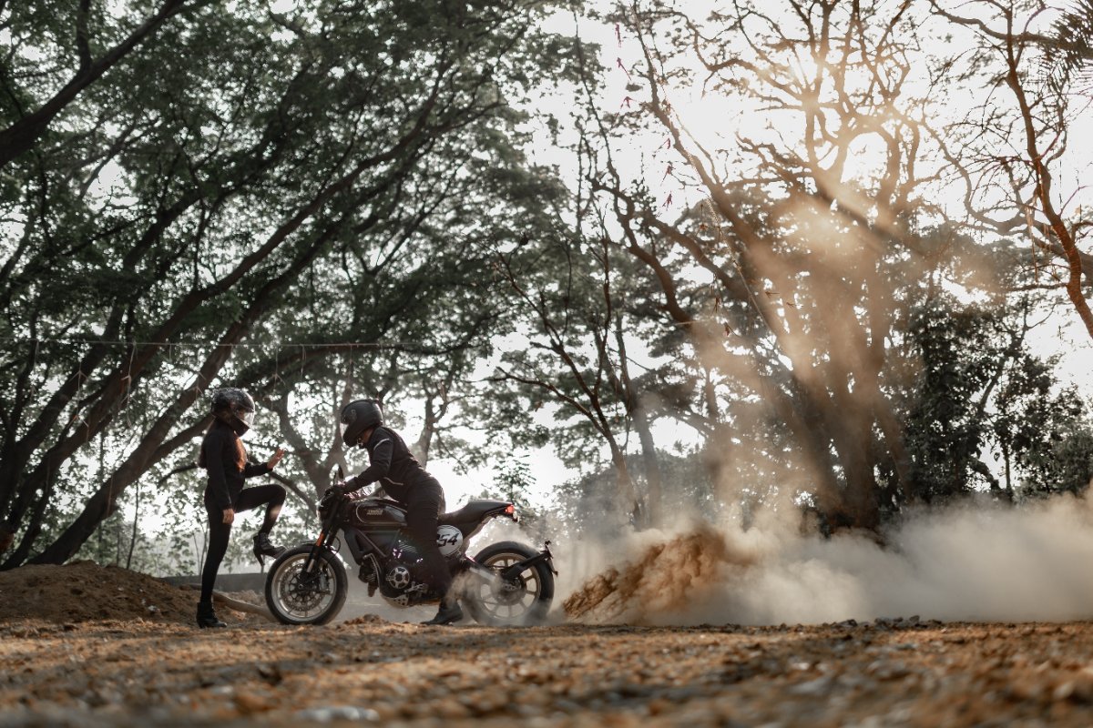 Pre-wedding couple shoot by WeddingClickz — dust, a bike and a long lens
