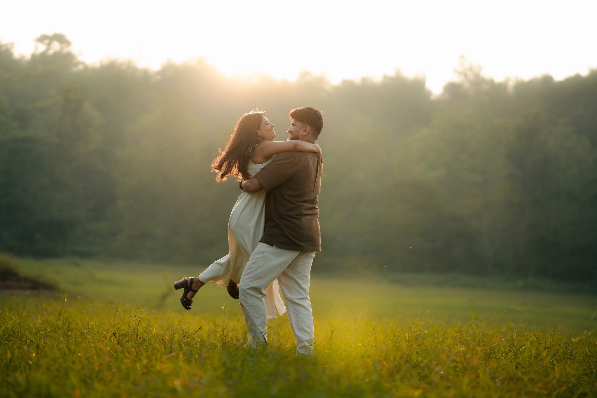 Couple photographed in low golden light during a pre-wedding shoot by WeddingClickz