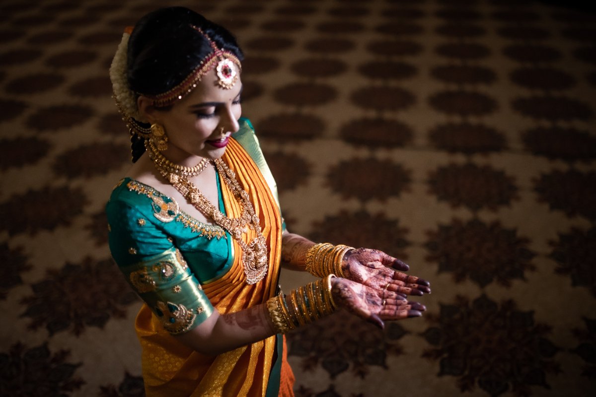 A candid, unposed wedding moment during a Bangalore wedding, shot by the WeddingClickz team